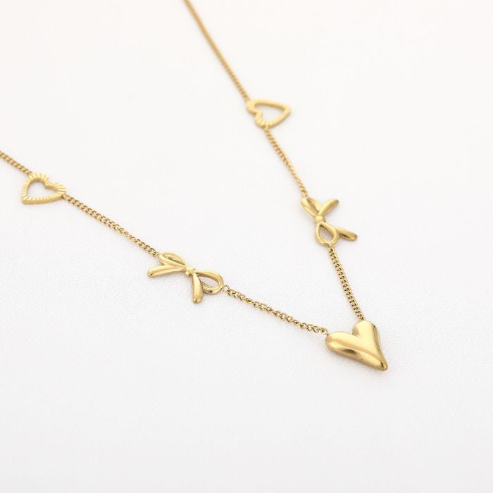 Goudenketting hartjes en strikjes